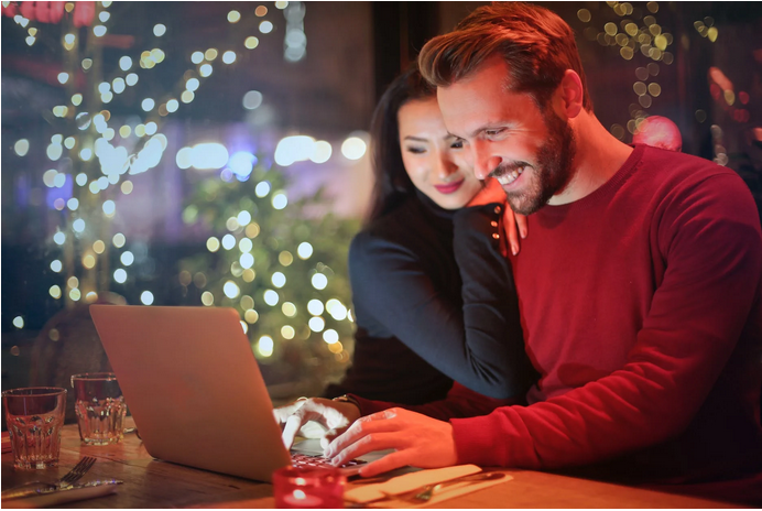 a man and a lady playing online casino